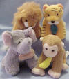 Gund Zip A Long Jungle Set of 4 - set includes a lion with leaf, a tiger with leaf, a monkey with a banana and an elephant with a peanut. Pull on the item and the jungle animal will wiggle and jiggle back to it! Each is 4" and made from a soft cuddly plush material.