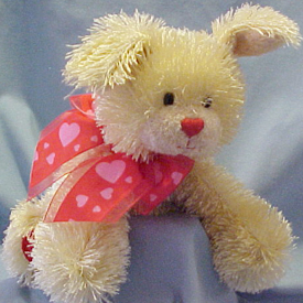 Gund Valentines Plush Tootsie the Shaggy Dog
- Material is super silky soft shaggy which reminds me of the old fashioned flapper girl dresses from the 1920's. Back paws have red velvety heart shape pads. There is a sheer and satiny red bow with pink hearts all over it tied around the neck.
- safe for all ages