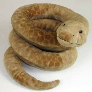 Cuddly soft serpents! Snakes from small to large all in a cuddle up with stuffed animals.