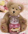 Boyds Rosie Bear with Rose Yankee Candle - (introduced in Fall 2003 as an Exclusive and has been retired) Everyone loves roses, especially Rosie, our Yankee Candle exclusive. This mixed gold gal is wearing a pink bow, special pink rosettes, features rose, and Yankee Candle embroidery on her foot pads, and comes with her very own Fresh Cut Roses 3.7oz. Yankee Candle. Rosie is fully jointed. 8 inches high