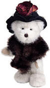 Boyds Dixie Hackett White Teddy Bear - (introduced Fall 2001 and has been retired) Dixie's from old money...and flaunts it every chance she gets! This beige beauty is dressed in a velvet hat with black net veil and cabbage rose accent and a satin-lined faux-mink stole.  10 inches and poseable
