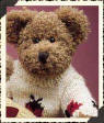 Boyds Cori Beariburg Teddy Bear -  (introduced Spring 2000 and has been retired)   Cori has embroidered & knitted teeny tiny ladybugs into his Sweater...hoping to attract a few more friends. He has a beautiful mocha colored Chenille fur.  8 1/2 inches and poseable