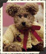 Boyds Darby Beariburg Teddy Bear - (introduced Spring 2000 and has been retired)  Darby has Chenille mocha brown fur. Her Buttercup sweater is knitted with a ladybug on it. Darby has a red ribbon around her neck.  6 inches and poseable