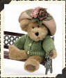 Boyds Teddy Bear Mrs. Trumbull - (introduced Spring 1998 and has been retired)  Mrs Trumbull is dressed in a beautiful green button up sweater. Her adorable little taupe felt hat is accented with a large pink rose and smaller smoky pink roses with luscious green leaves.  10 inches and poseable