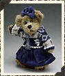 Boyds Nadia Berriman  Teddy Bear - (introduced Fall 1999 and has been retired)   In her best indigo velvet jumper and snowflake sweater, Nadia is ready to receive guests at the Berriman's Winter Ball. She is a BEAUTIFUL plush beige bear with an indigo bow on the fur between her ears.  10 inches and poseable