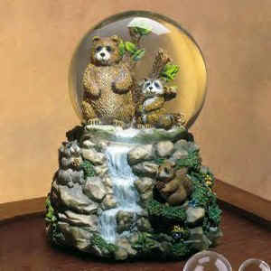 Lou Rankin, who is an artist and sculptor, captures the connection between man and animal through his trademark tender-eye expressions in his Snowglobes and Musical Figurines depicting Dogs, Bears and more.