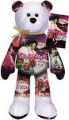 Elvis Presley Viva Las Vegas Teddy Bear - (this is the 7th bear in the series) Tag information: In July 1963, Presley films his fourteenth motion picture, Viva Las Vegas, co-starring Ann-Margaret. Their chemistry on screen sizzles, and the film released in June 1964 is a huge success. The soundtrack album for the movie is also a smash hit. Elvis Presley Enterprises, Inc. has authorized Limited Treasures to produced LIMITED Edition Elvis Presley Teddy Bears that are fully licensed. This series is INCREDIBLE! Limited Treasures has perfected a technique to take full color images and permanently imprint them on a canvas of plush bean bears, while maintaining the soft plush feel of the fabric. 9 inches
