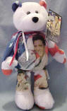 Elvis 'GI Blues' Teddy Bear 1958-1960 - (this is the 1st bear in the series) The Elvis GI Blues Bear has colorful images from his Military Service combined with a Patriotic Theme. The Bear wears a tag with information about Elvis' Military Service: "This commemorative bear 'GI Blues', fondly remembers Elvis Presley's service in the U. S. Army. Inducted on March 24, 1958 and stationed at Fort Hood, Texas for basic training, Elvis then served in Friedberg, Germany for 18 months. Elvis is promoted to Sergeant in January 1960. Elvis Presley Enterprises, Inc. has authorized Limited Treasures to produced LIMITED Edition Elvis Presley Teddy Bears that are fully licensed. This series is INCREDIBLE! Limited Treasures has perfected a technique to take full color images and permanently imprint them on a canvas of plush bean bears, while maintaining the soft plush feel of the fabric. 9 inches high