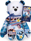 Elvis 'Blue Hawaii' Teddy Bear - (this is the 16th bear in the series) The Elvis Blue Hawaii Bear has colorful images of his concert. Both the front and the back of the bear are GREATLY detailed! The Bear wears a tag with the following information: "In 1961, Elvis travels on location to Hawaii to film his eighth motion picture, Blue Hawaii. This comedy/musical has Elvis portraying a character, Chad, who has just gotten out of the army and is happy to be back in Hawaii with his surf buddies and girlfriend. The album soundtrack for this film was Elvis' most successful, spending 20 weeks at #1 on the Billboard's top LP chart in 1961-1962." 9 inches