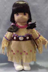 Precious Moments Doll Jicarilla Apache (12 1/2" H) (1996 Precious Moments, Inc.) The arms, hands, legs, feet, and head are hard plastic. The body is plush. Her tag reads: "American culture owes much of its richness to the contributions of Native Americans, from their traditions, art, crafts, music, religion, and leadership. PRECIOUS MOMENTS salutes the American Indian people. Crossed arrows with hearts on the end represent friendship. Precious Moments never end when shared with a forever friend. Native American Indians Doll Collection Huwuni, Dawn, Apache. This doll is a cherished part of our Precious Moments Native American Indians Doll Collection. She is a Limited Edition collectible doll, a creation of the finest quality and workmanship. This certificate of authenticity verifies that the doll is an exclusive Limited Edition. Only the finest materials have been used in the making of this doll."