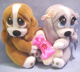 The always adorable Sad Sam and Honey Basset Hounds hold a birthstone gem on a dog bone between them representing each month of the year.
